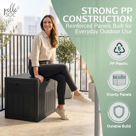 Woman sitting on the 126L storage box showing its strong PP construction