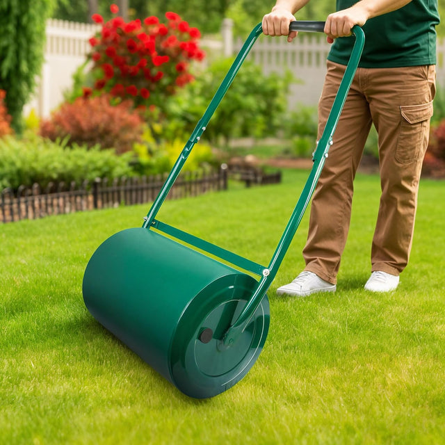 Rolling a lawn with the green galvanised steel lawn roller